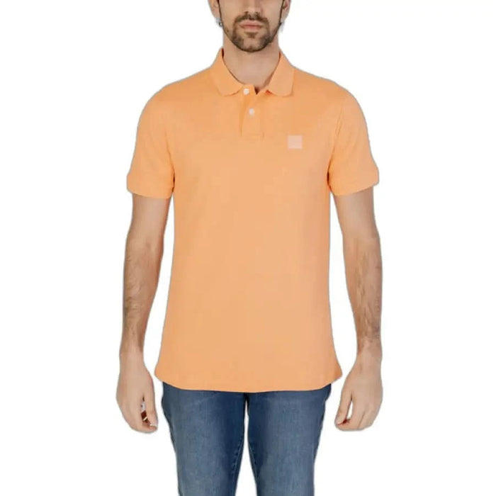 Boss Men Polo - Stylish man in orange shirt for spring summer product, boss gender fashion