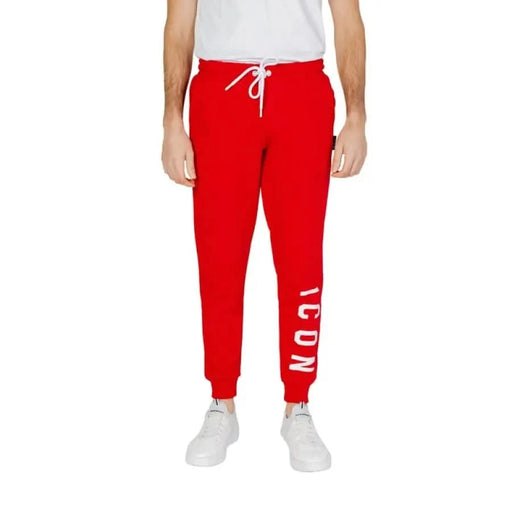 Icon Icon Men wearing red sweat pants with white lettering, Icon Men Trousers