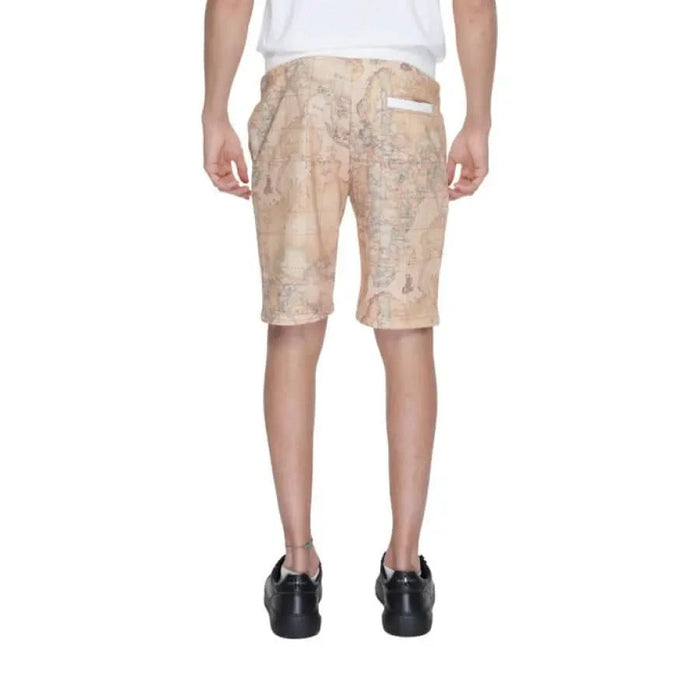 Man wearing ’Alviero Martini Prima Classe’ map print shorts