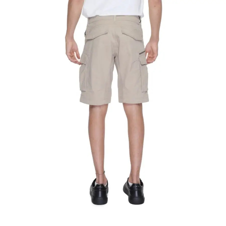 Man wearing Replay Men Shorts and a white T-shirt