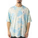 Urban style: Man in tie-dye t-shirt against blue sky - Jordan Men T-Shirt