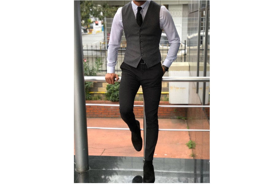 Man in formal gray waistcoat showcasing old money style for an elegance look.