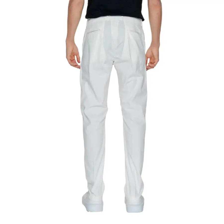 Urban style: Man in white pants and black shirt from Borghese Men Trousers collection