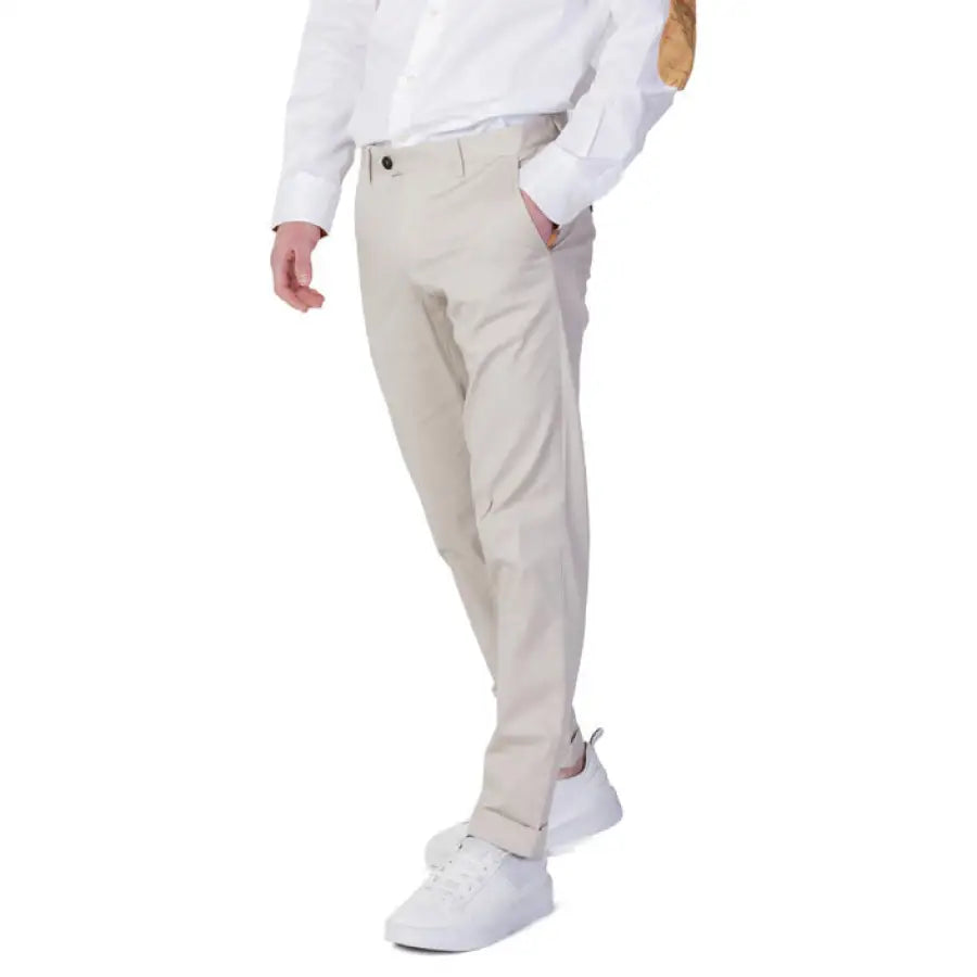
                      
                        Man in Alviero Martini Prima Classe Men Trousers wearing a white shirt and beige pants
                      
                    