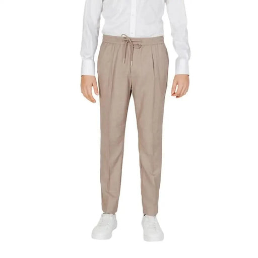 Man in Antony Morato white shirt and brown trousers for Antony Morato Men Trousers product