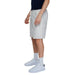 Man wearing white shorts and black t-shirt, featured in Jack & Jones Men Shorts collection