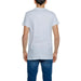 Man in Alviero Martini Prima Classe white t-shirt and jeans, stylish and casual