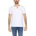 Man wearing Alviero Martini Prima Classe white t-shirt and jeans