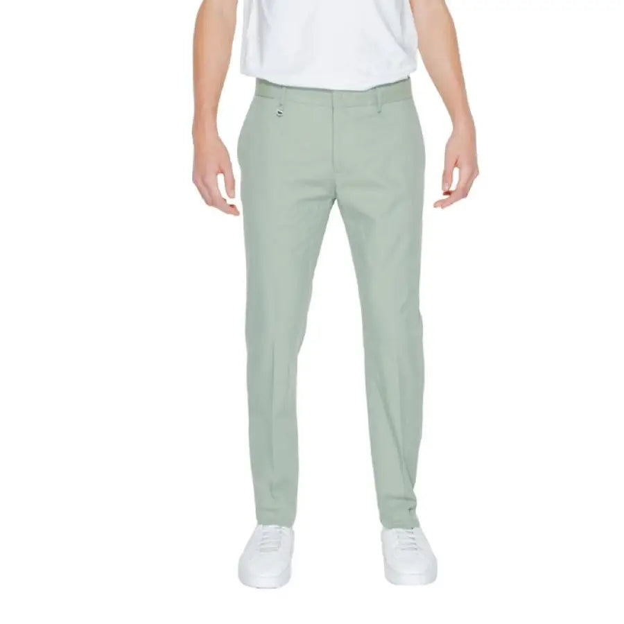 Man in white t-shirt, green Antony Morato trousers - Urban style