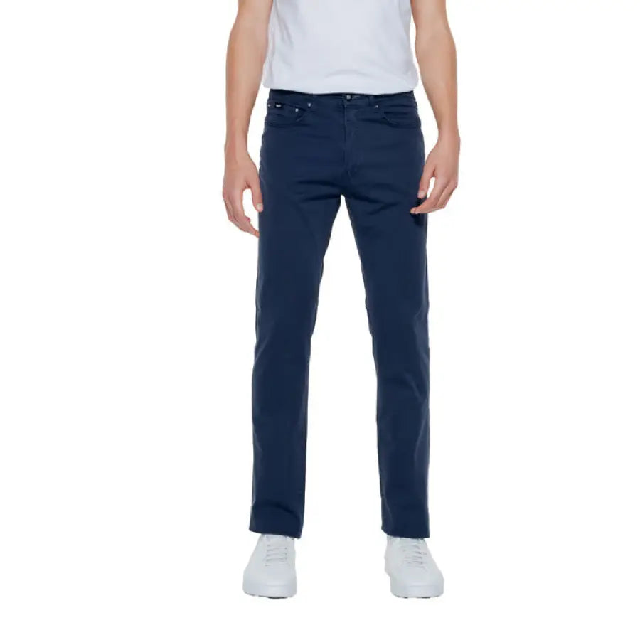 Urban style: Man in a white t-shirt and blue jeans from Gas - Gas Men Trousers collection