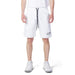 Man in Icon urban style clothing, showcasing white T-shirt and Icon Men Shorts in city