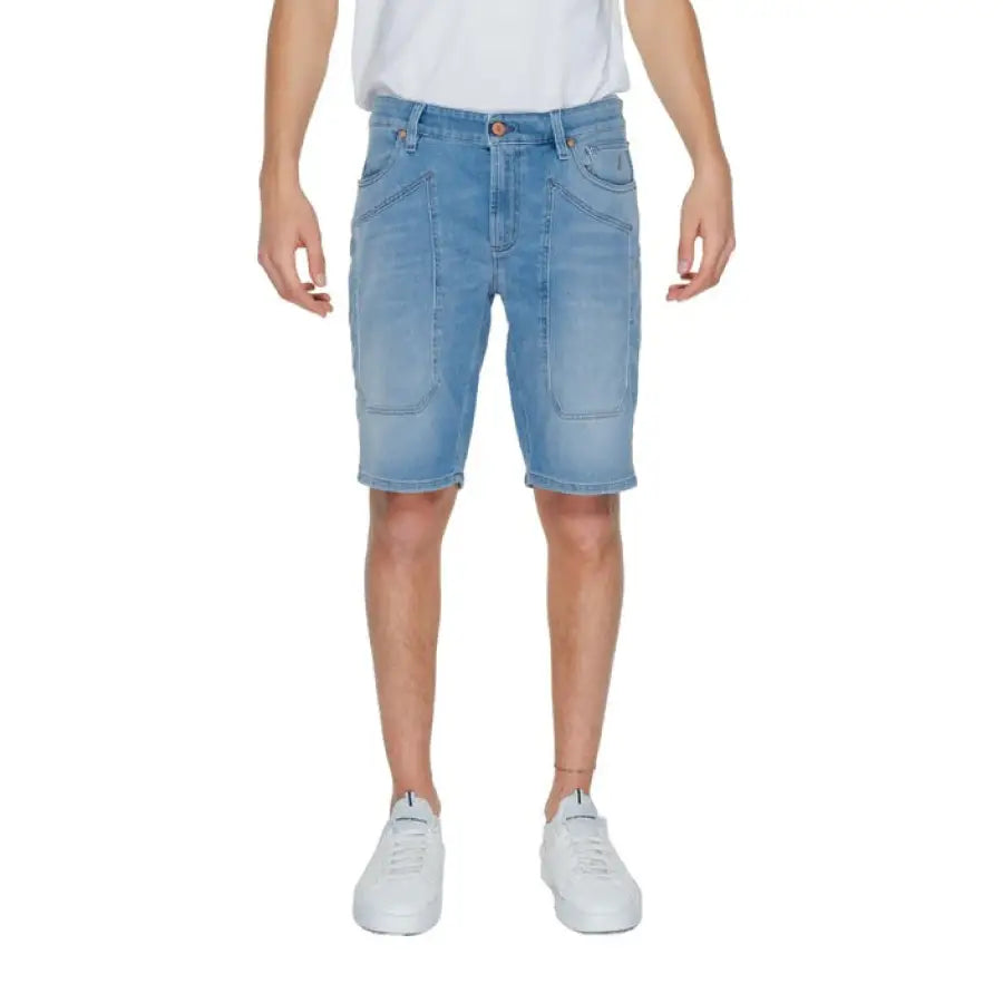A man wearing Jeckerson - Jeckerson Men Shorts in a white t-shirt and blue shorts