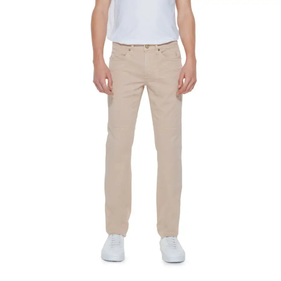 Man in khaki pants and white T-shirt showcasing urban style by Jeckerson Men Trousers