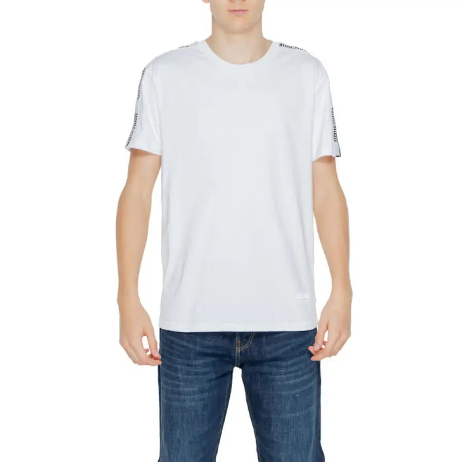 Man in Moschino Underwear white T-shirt and jeans