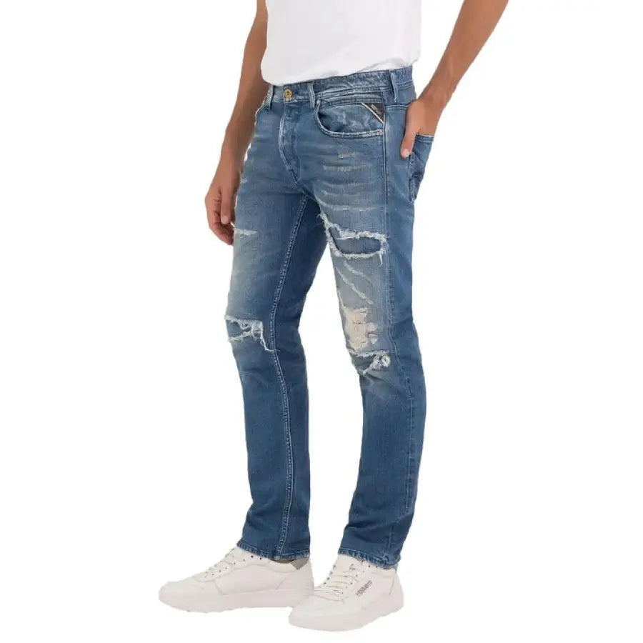 Urban style: man in white t-shirt and Replay Men Jeans