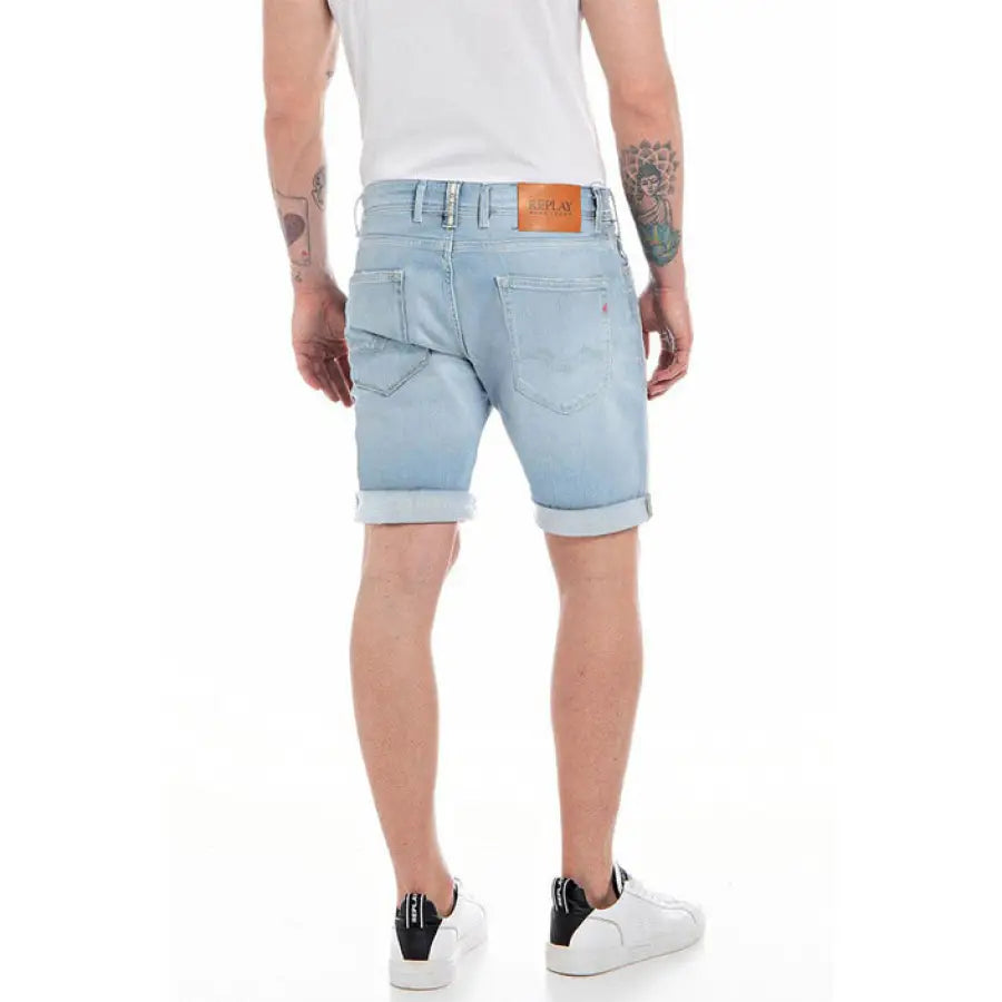 Man wearing white t-shirt and blue shorts from Replay - Replay Men Shorts collection