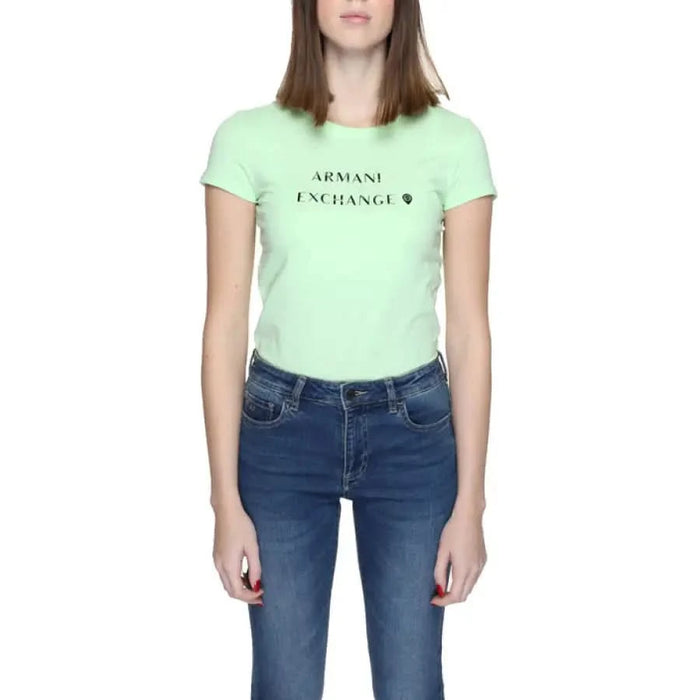 Mint green Armani Exchange Women’s T-Shirt paired with blue jeans, stylish casual wear