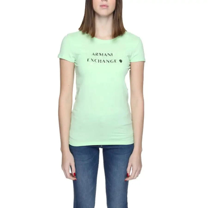 Mint green Armani Exchange t-shirt paired with blue jeans for a trendy look