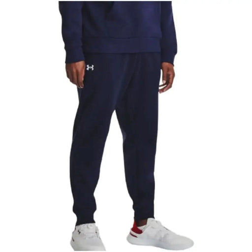 Navy blue Under Armour athletic sweatpants featuring logo, ideal for men’s activewear