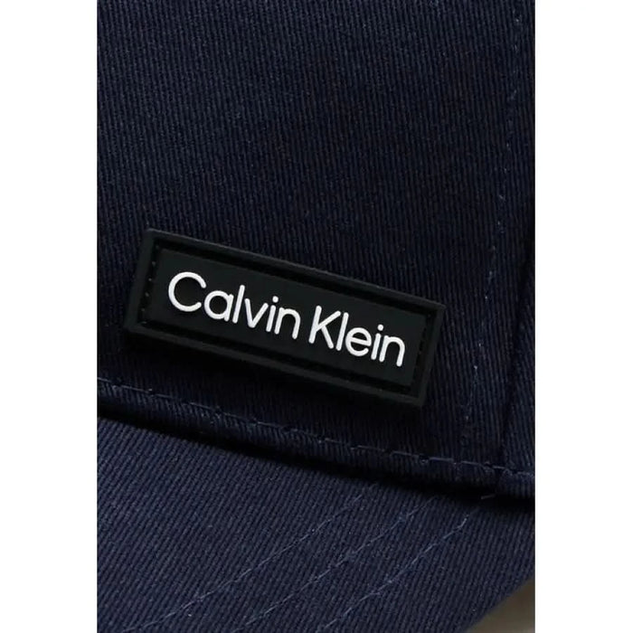 Navy blue Calvin Klein cap featuring a logo patch for men’s fashion