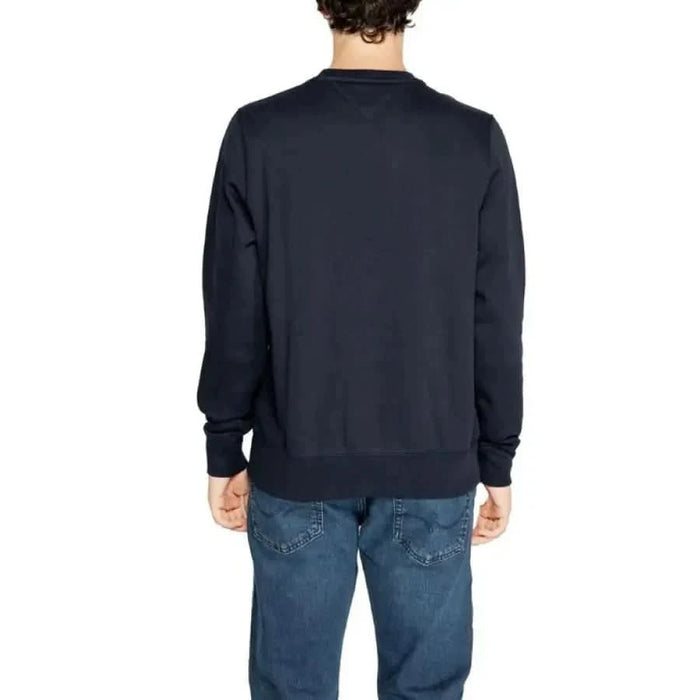 Navy blue crewneck sweatshirt displayed from the back by Tommy Hilfiger for men