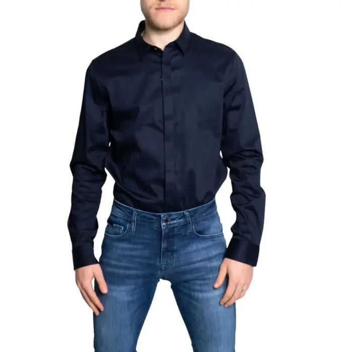 Armani Exchange men’s navy blue dress shirt paired with blue jeans