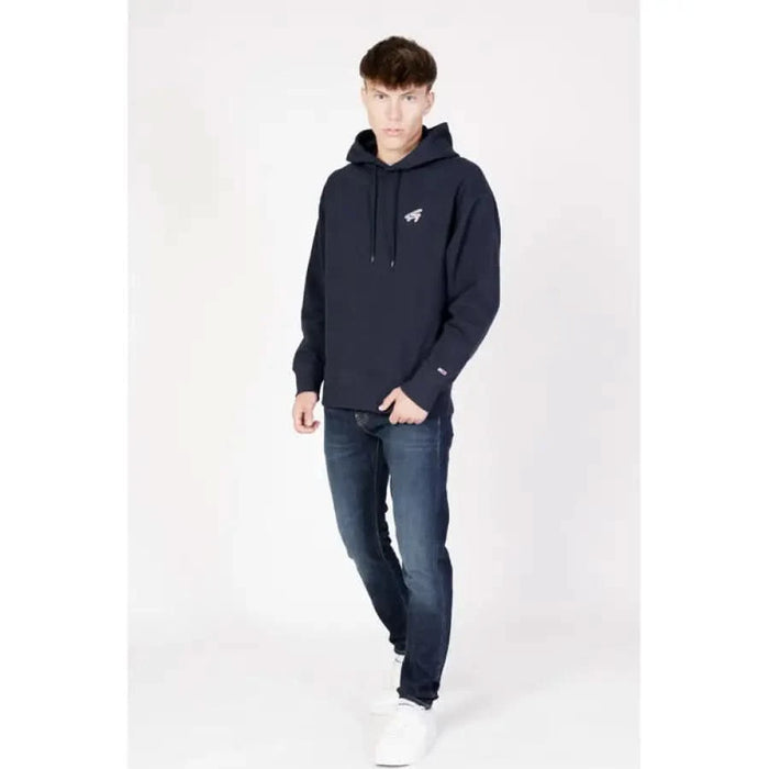 Navy blue hooded sweatshirt with small white logo by Tommy Hilfiger Jeans for men