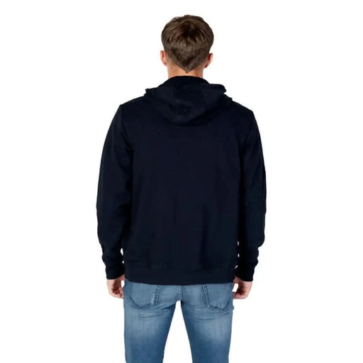 Person wearing Navy Blue Hooded Sweatshirt from Tommy Hilfiger Jeans, back view