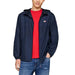 Navy blue Tommy Hilfiger hooded jacket over a red t-shirt with logo