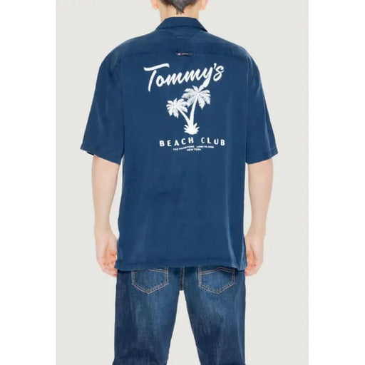 Navy blue shirt featuring Tommy’s Beach Club and palm tree design from Tommy Hilfiger Jeans