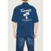 Navy blue shirt featuring Tommy’s Beach Club and palm tree design from Tommy Hilfiger Jeans