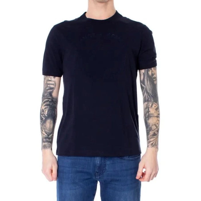 Navy blue short-sleeved Armani Exchange Men’s T-Shirt worn by person with heavily tattooed arms