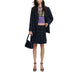 Navy blue skirt suit with floral embellishments and striped crop top by Desigual