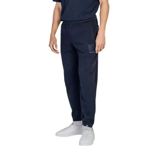 Navy blue Armani Exchange men trousers featuring elastic cuffs at the ankles