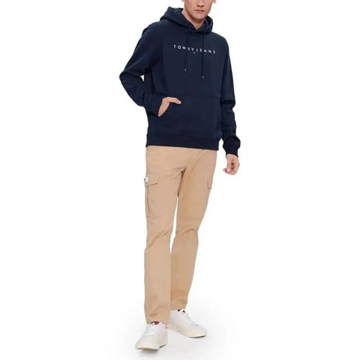 Navy blue Tommy Jeans hoodie with khaki cargo pants and white sneakers - Tommy Hilfiger Men