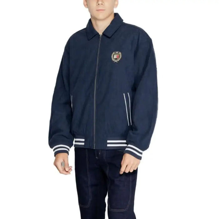 Navy blue varsity jacket with white stripes and embroidered patch by Tommy Hilfiger Jeans