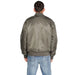 Olive green bomber jacket over blue jeans, back view of Calvin Klein Men Jacket