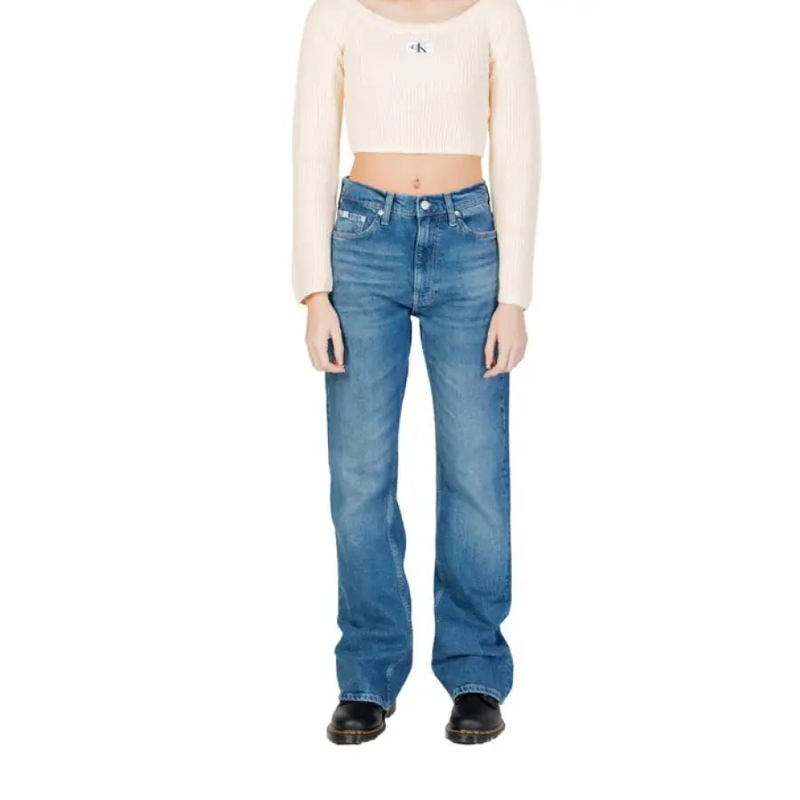 Calvin Klein cropped white long-sleeved top and blue jeans for women