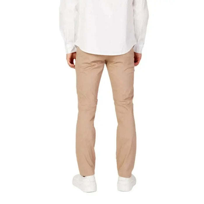 Armani Exchange Men Trousers in beige paired with a white shirt and white shoes