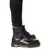 Black Dr. Martens boots with white sole for urban style clothing and city fashion