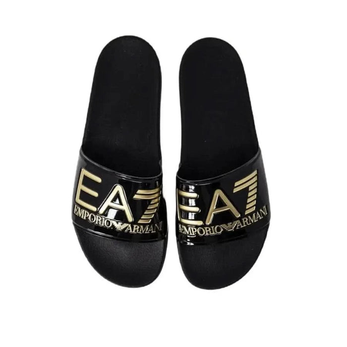 Pair of black slide sandals with gold EA7 Emporio Armani branding for women