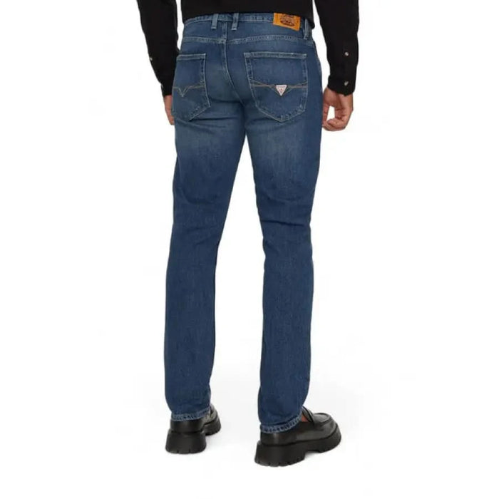 Back view of Guess Men Jeans showcasing a stylish pair of blue denim jeans