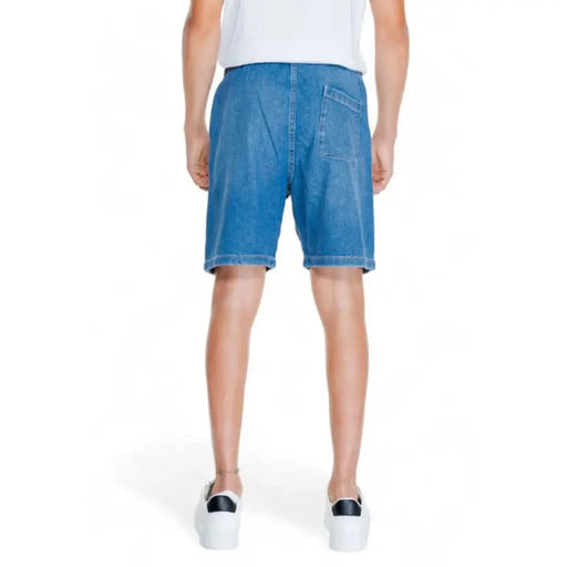 Jack & Jones Men Shorts - Pair of blue denim shorts worn by a person