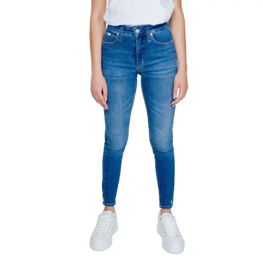 Calvin Klein Jeans - Pair of blue skinny jeans with white sneakers and a white top