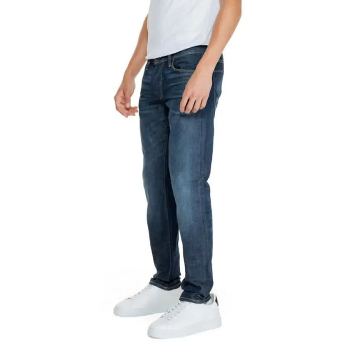 Dark blue denim jeans worn by a person from Jack & Jones Men Jeans collection