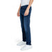 Dark blue Tommy Hilfiger men jeans paired with white sneakers for a stylish look