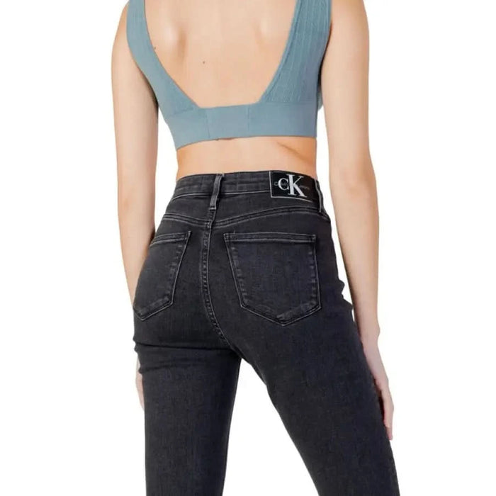 Calvin Klein dark-wash high-waisted women’s jeans with logo on waistband