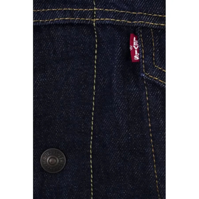 Back view of Levi’s Men Jacket showcasing the detailed stitching on a pair of jeans