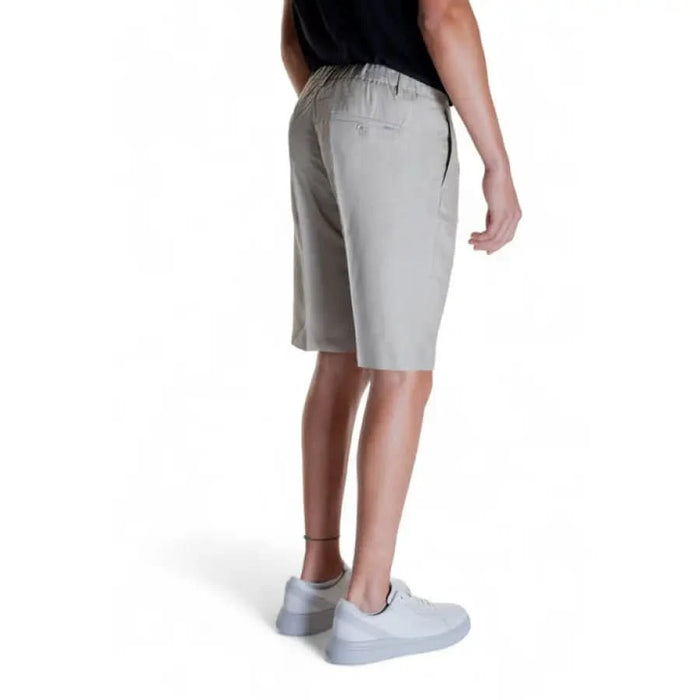 Antony Morato Men Shorts in light gray showcased by a person wearing knee-length shorts