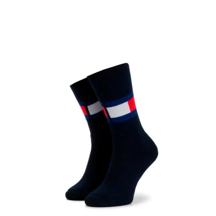 Pair of navy blue Tommy Hilfiger socks with red, white, and blue striped ankle bands